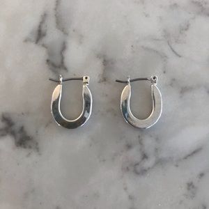 Small silver “horseshoe”-shaped hoop earrings